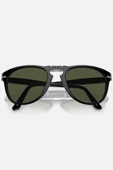 Occhiali da sole Persol PO714 95/31 neri con lenti verdi, modello folding misura 54-21, design vintage italiano.