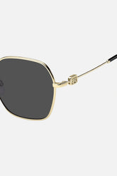 Occhiali da sole Tommy Hilfiger TH 2150/S RHLIR, montatura oro con lenti grigio scuro.