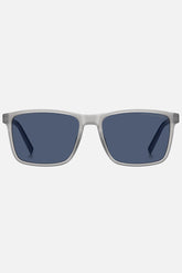 Occhiali da sole Tommy Hilfiger TH 2201/S 09VKU, montatura trasparente opaco con aste blu e lenti blu.